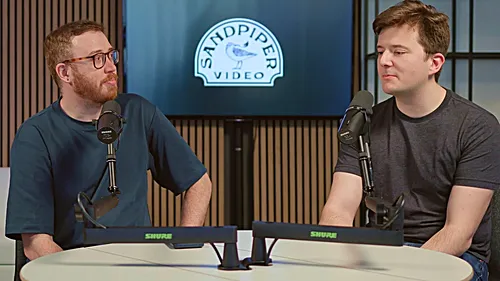 Evan and Justin recording in Sandpiper's downtown Seattle studio, with Shure microphones and the Sandpiper Video backdrop
